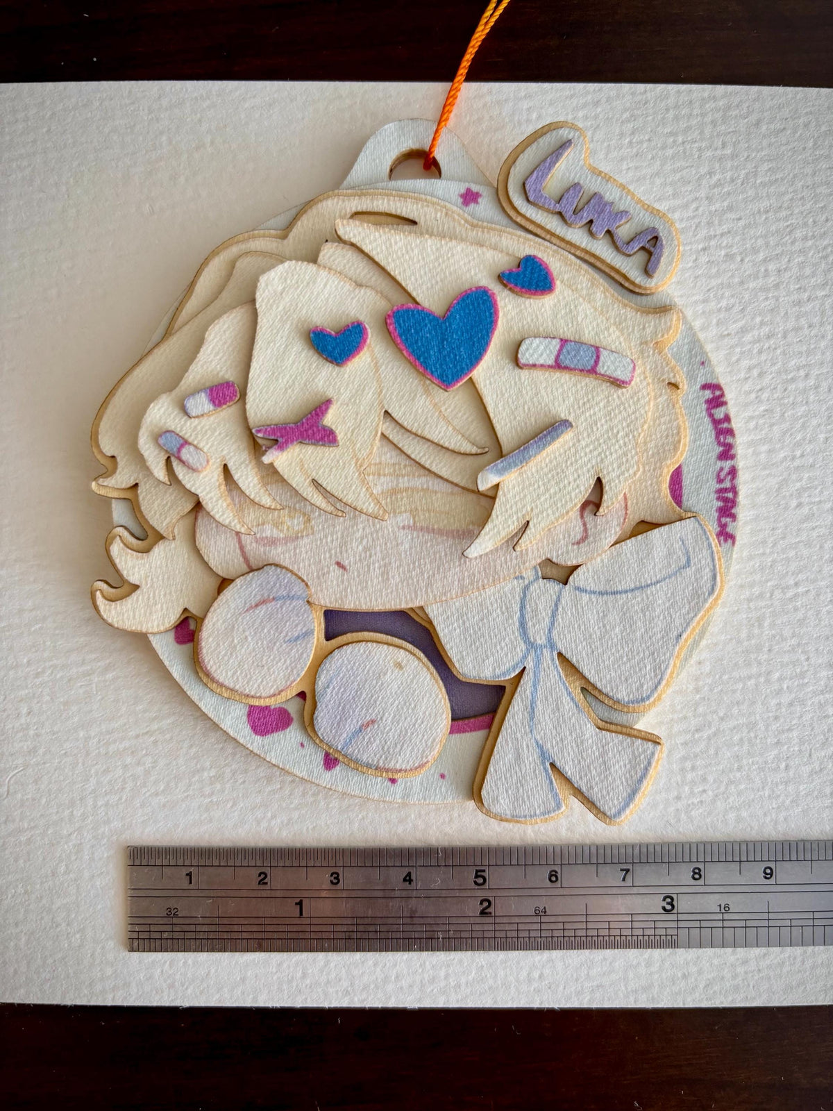 Luka | ALNST | paper biscuit, charm/ornament | ~10x9cm